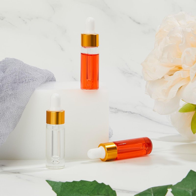Didaey 200 Pcs 5 ml Mini Glass Oil Dropper Bottle Bulk, Clear Essential Small Empty Bottles Sample Containers Perfume Liquid Vials with Cap for Traveling (Champagne Gold)