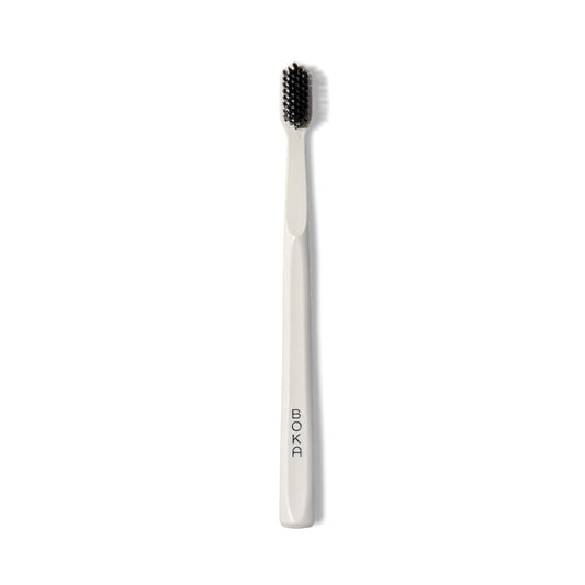 Boka Classic Manual Toothbrush with Extra Soft Activated-Charcoal, Tapered Bristles, Bioplastic Handle that Includes Travel Cap, Dentist-Approved, Great for Adults and Kids, White (Pack of 1)