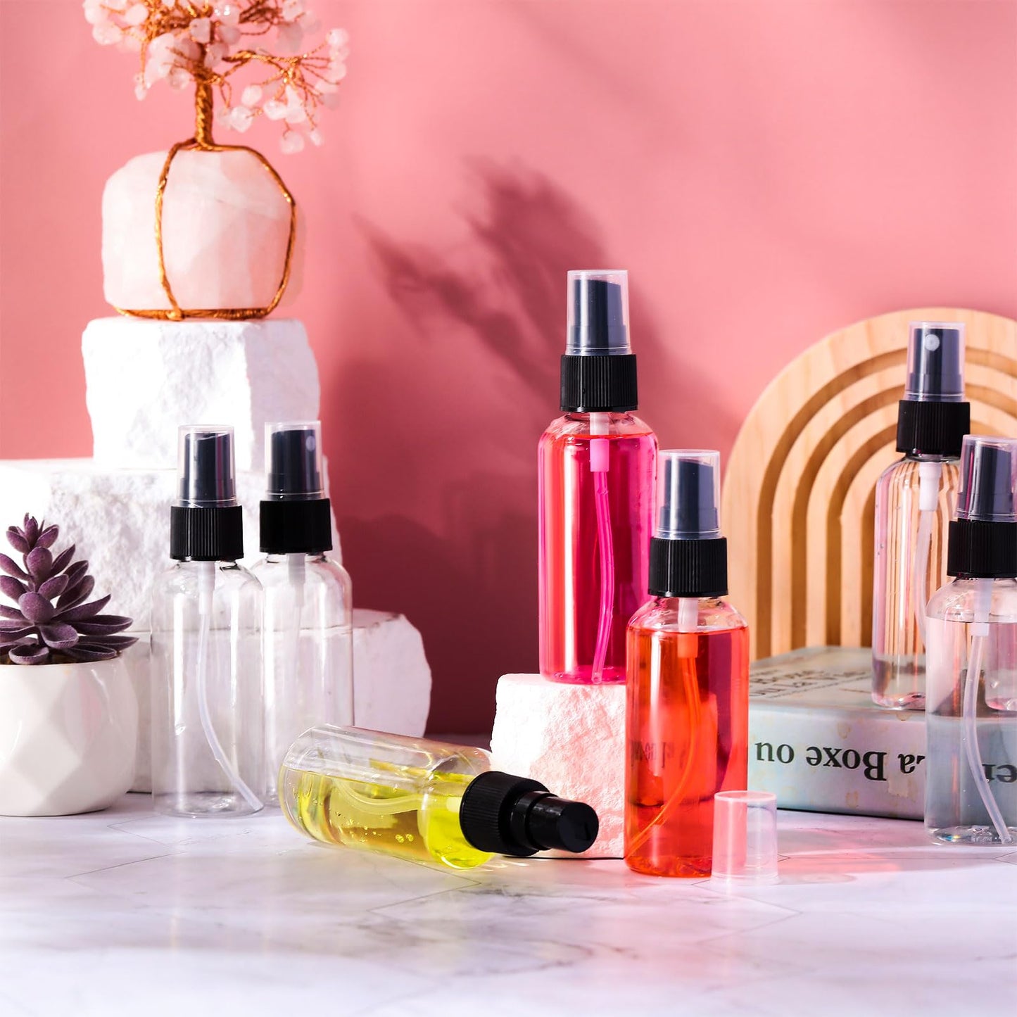Roshtia 100 Pcs 2 oz Plastic Mini Spray Bottles with Black Cap Clear Empty Fine Mist Spray Bottles Refillable Liquid Container for Essential Oils Perfumes Travel Makeup