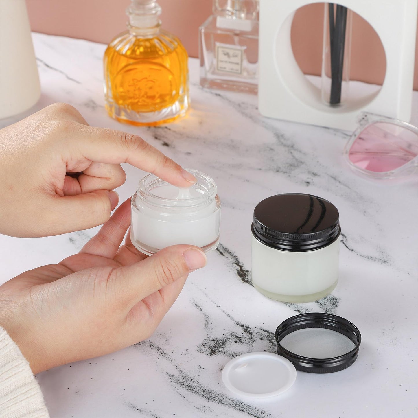 RAMFIYN 24 Pack 2oz Clear Glass Jars Small Glass Containers with Black Metal Lids Empty Cosmetic Jars with Inner Liners and Lids Clear Glass Lotion Jars with Labels for Traveling
