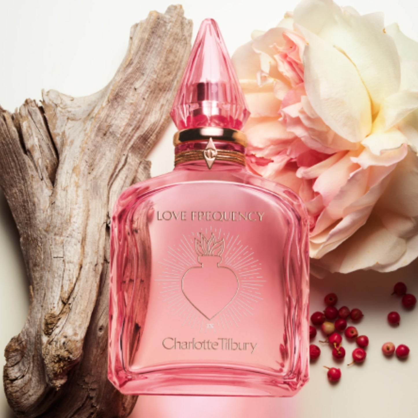 Charlotte Tilbury Love Frequency Eau De Parfum - Pheromone Enhancing Floral Perfume Enriched with Naturally-Derived Oils - Long-Lasting Scent with Notes of Patchouli Musk & Rose (10ml)