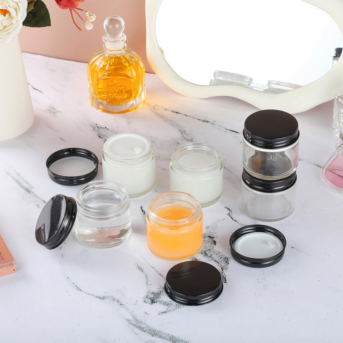 RAMFIYN 24 Pack 2oz Clear Glass Jars Small Glass Containers with Black Metal Lids Empty Cosmetic Jars with Inner Liners and Lids Clear Glass Lotion Jars with Labels for Traveling