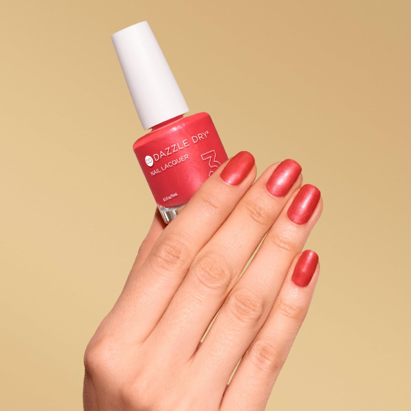Dazzle Dry Nail Lacquer (Step 3) - Poolside Pink - A deep coral pink-red. Semi-sheer shimmer. (0.5 fl oz)